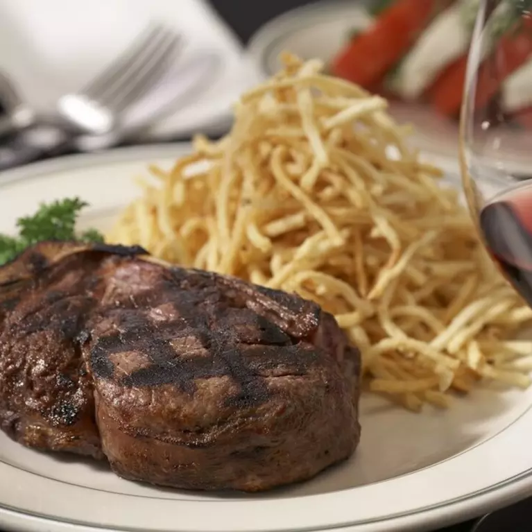 steak dinner and glass of wine