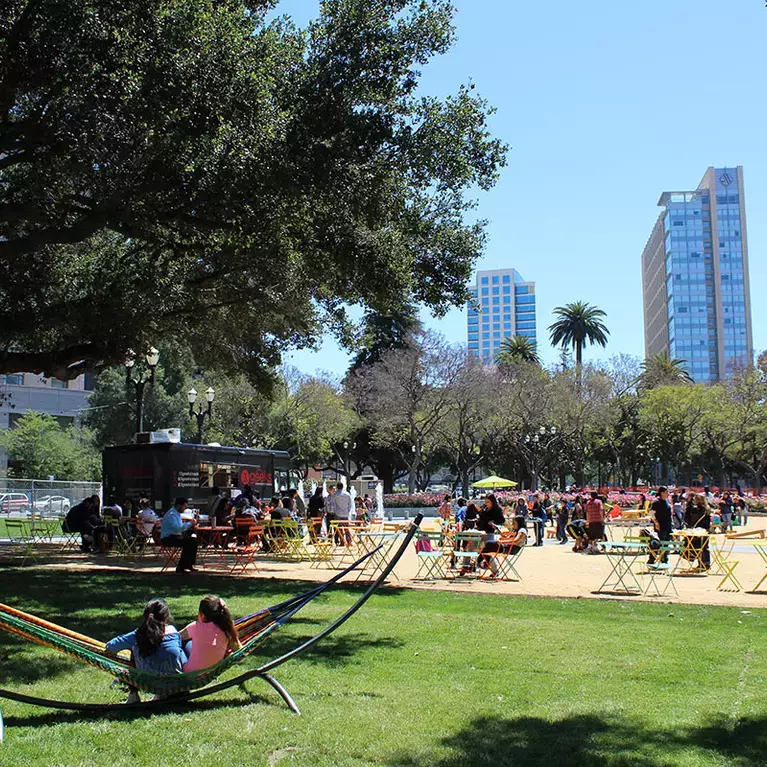 Families enjoy a warm summer day with food truck at Cesar Chavez Park