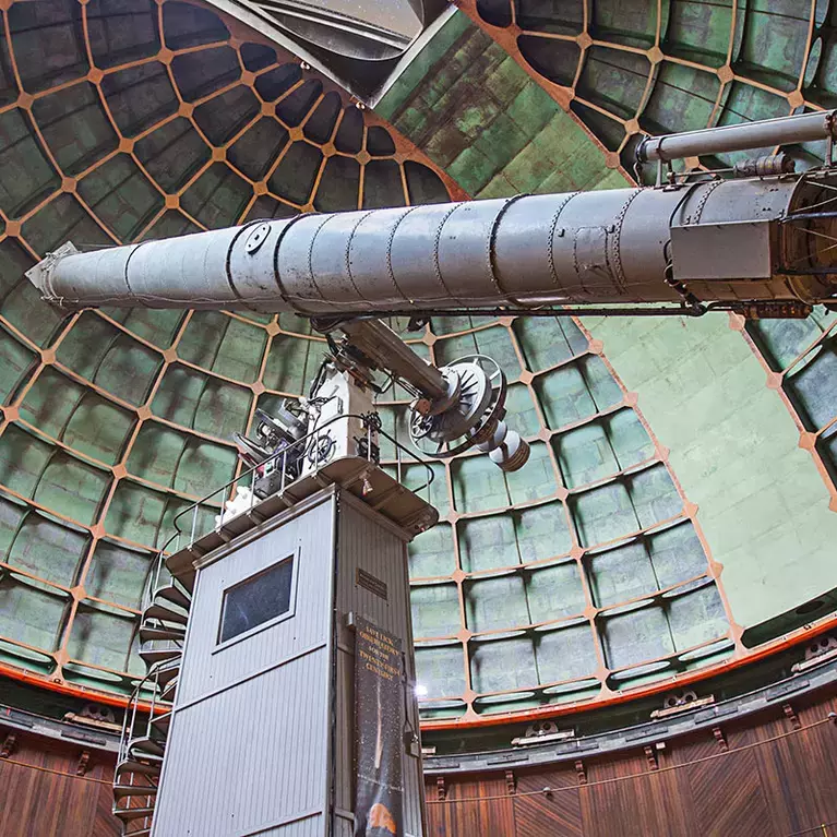 Visitors look up at the main refractor in the big dome at Lick Observatory on Mount Hamilton