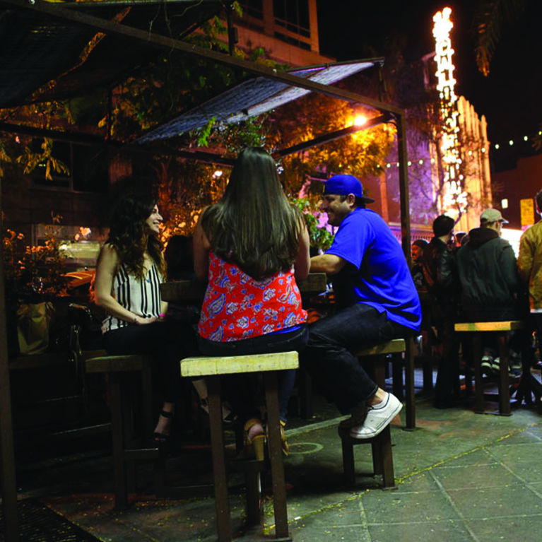 Groups mingling and enjoying cocktails in SoFA district downtown