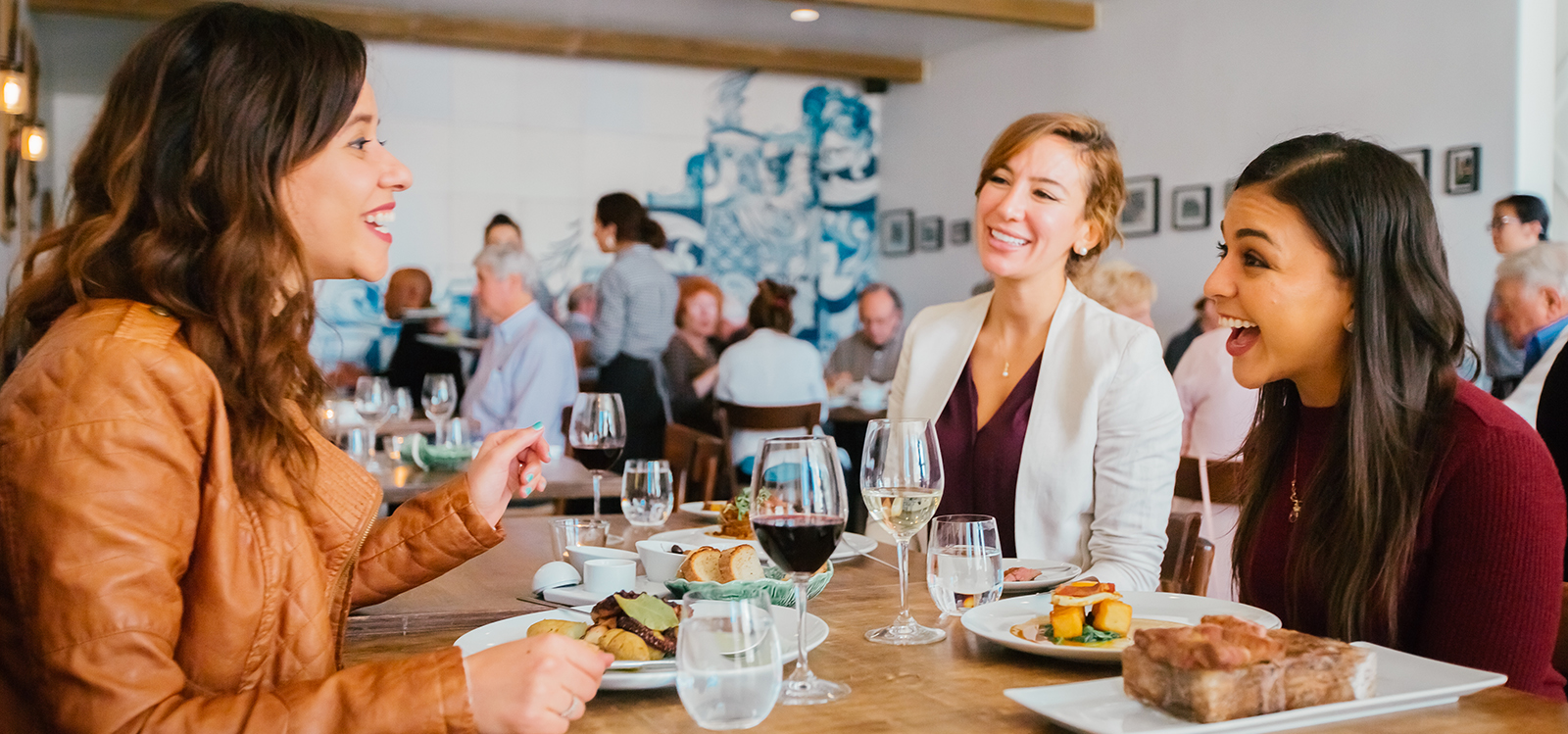 Ladies dining in the upscale Michelin-star restaurant, Adega