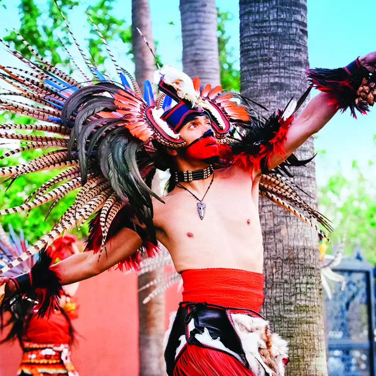 Aztec dancer performs in an Aztec ceremonial dance at the Mexican Herritage Plaza