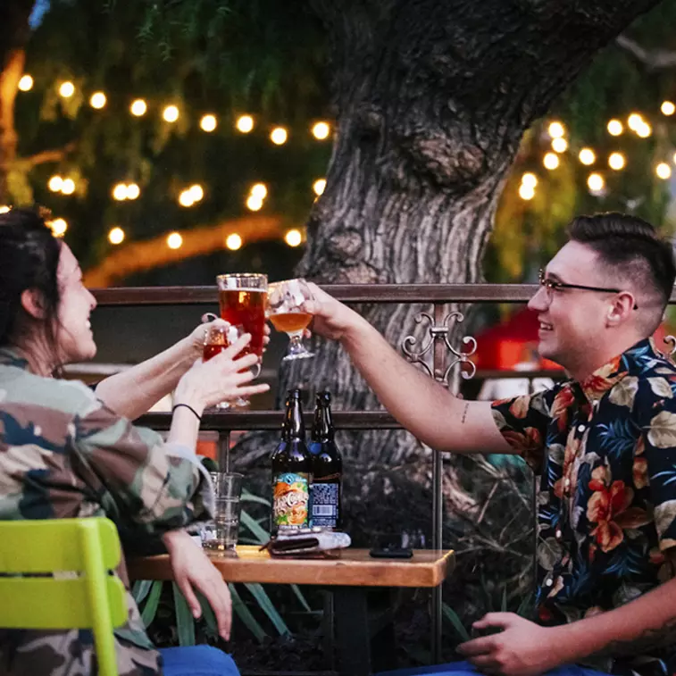 Friends toasting with beer at Santana Row in San Jose