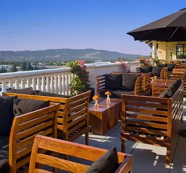 A patio setting with gorgeous views of the Mountains at Cielo Wine Bar
