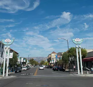An image looking down Jackson Street, the main drag of Japantown, with the rolling east foothills in the background