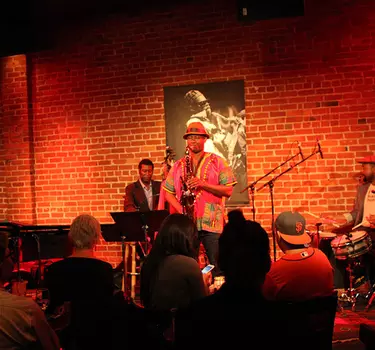 A 3-piece Jazz band performing for a full house at Cafe Stritch
