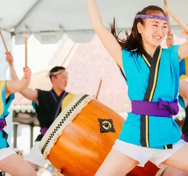 San Jose Taiko drummers performing for a crowd in the streets of Japantown