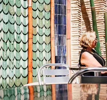 Women enjoying wine under the sun at the Vintage Wine Bar