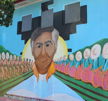 A mural of Cesar Chavez across from the community center.