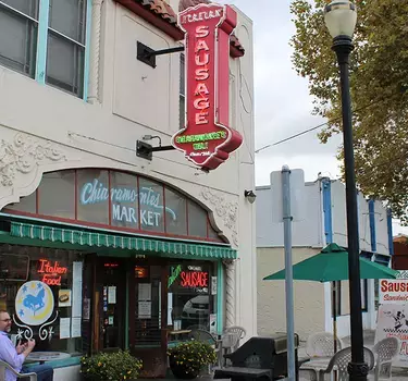 The exterior and neon sign of Chiaramonte's Sausage & Deli since 1908