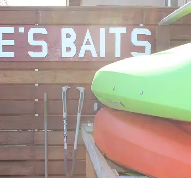 Kayaks available for rent outside of Laine's Baits and Rentals shop