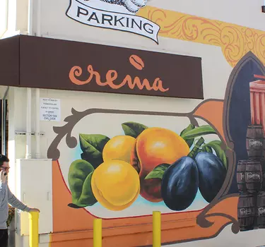 A mural on the wall outside of the new Crema coffee hangout location