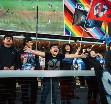 Young fans at a soccer match cheering on the San Jose Earthquakes at PayPal Park