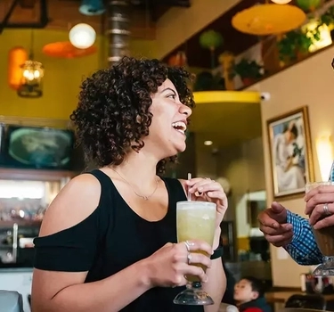 Customers enjoying a conversation at a restaurant in Vietnam Town