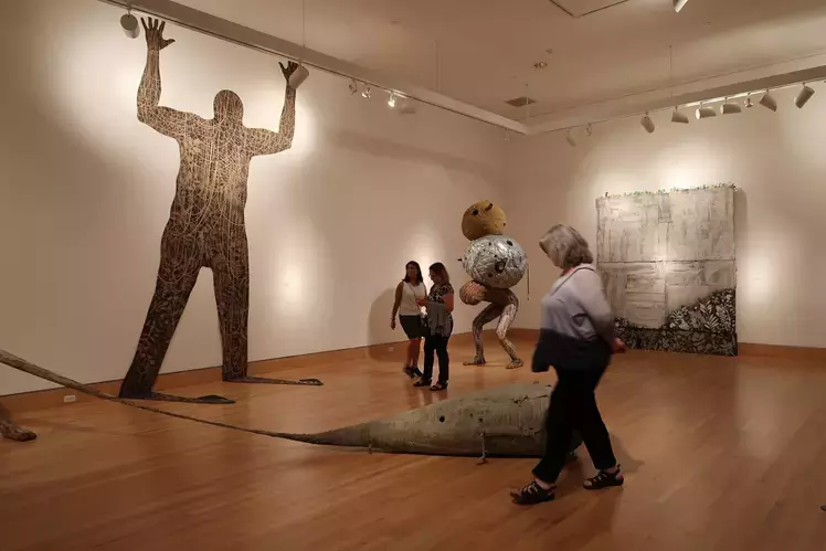 Visitors enjoy an installation at the Triton Museum of Art