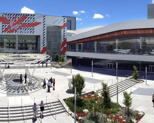 People walking around the San Jose McEnery Convention Center