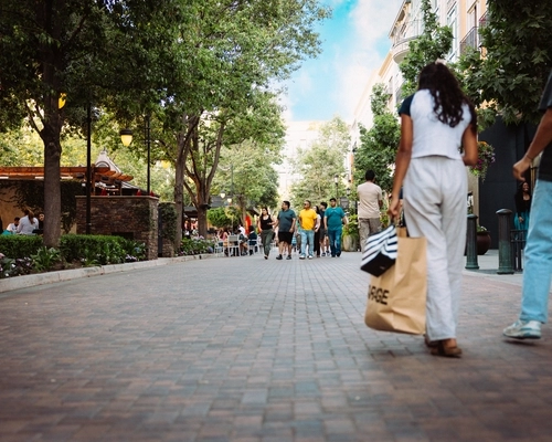 Shoppers walking along Santana Row in San Jose