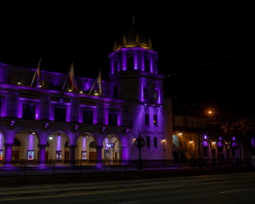 San Jose Civic at night lit up in purple lights for the Golden State Valkyries.