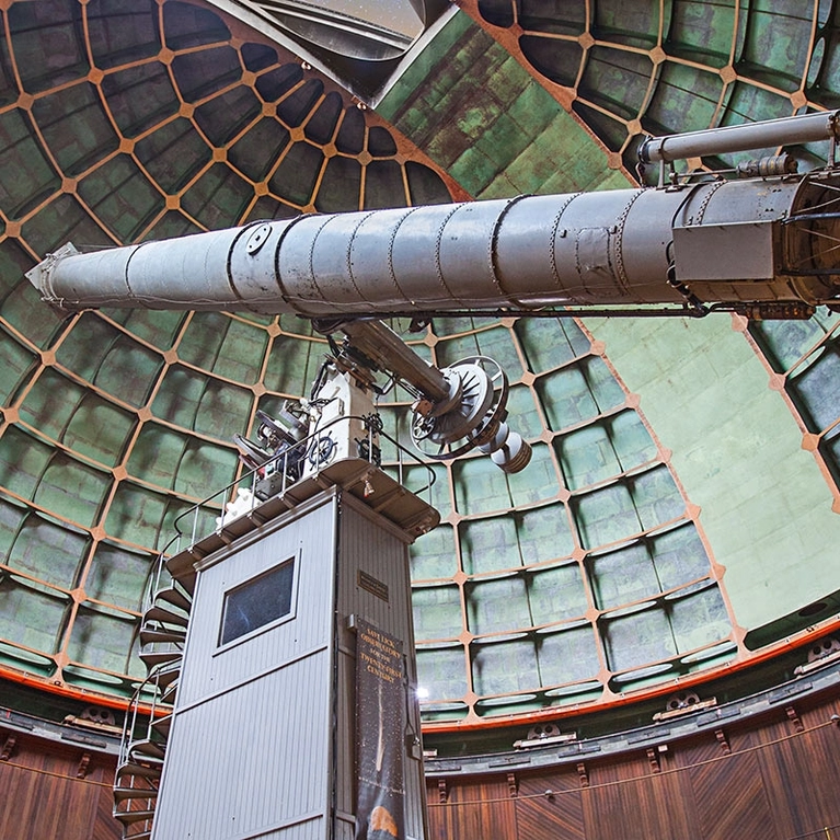 Visitors look up at the main refractor in the big dome at Lick Observatory on Mount Hamilton near San Jose
