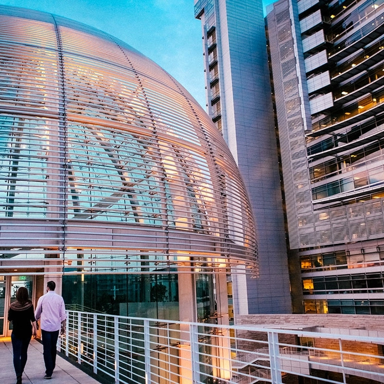 A couple walk into the Rotunda at San Jose City Hall