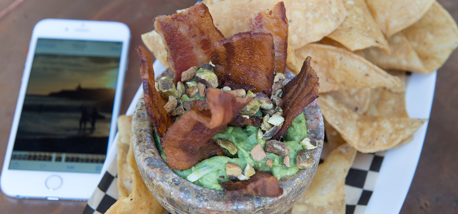 thick bacon slices in pastachio guacamole